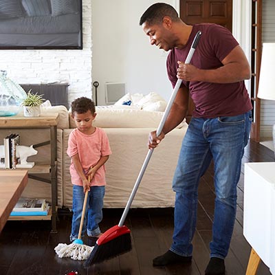 Man and son cleaning their house